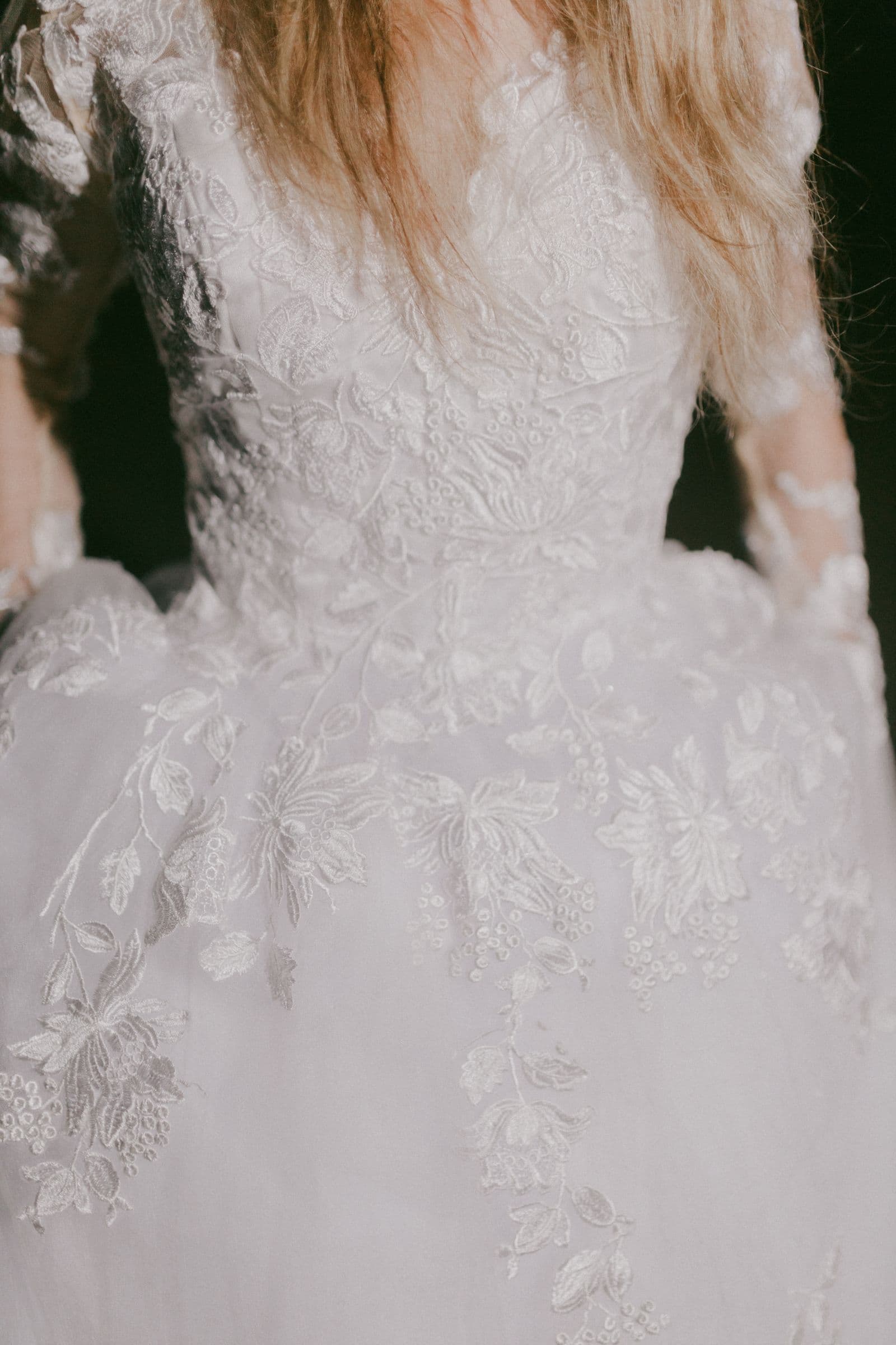 Lace and embroidery detail on a wedding gown bodice